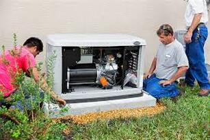 Electricians installing generator