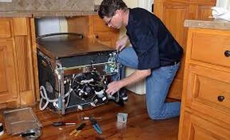 Electrician installing appliances